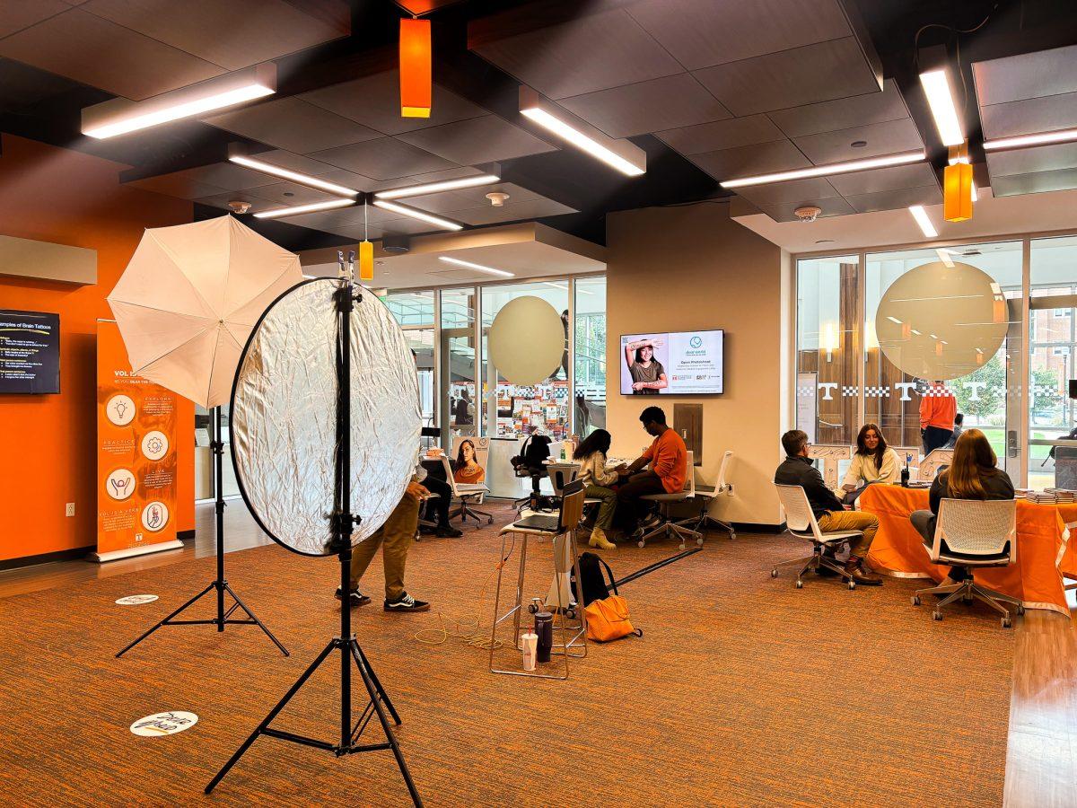 Students, staff and faculty members taking their photos with their self-discovery tattoo at an event hosted by Dear World. Oct. 16, 2024.