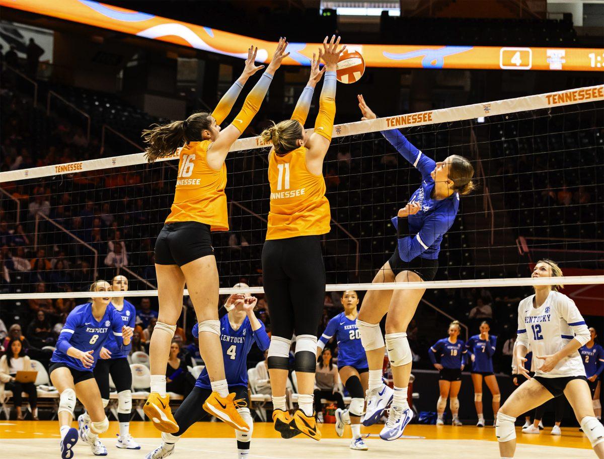 Caroline Kerr (11) and Chelsea Sutton (16) block the ball against Kentucky at Thompson-Boling Arena at Food City Center. Wednesday, Oct. 16, 2024.