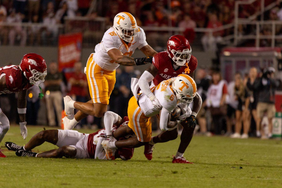 Dylan Sampson (6) is tackled by an Arkansas defender during a game at Donald W. Reynolds Razorback Stadium. Saturday, Oct. 5, 2024.