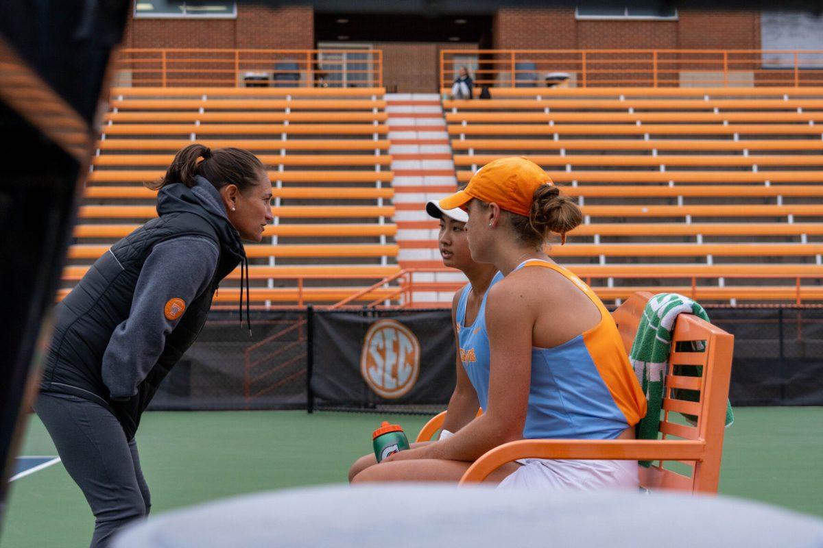 Head coach Alison Ojeda talks to Elim Yan and Maeve Thornton before their next set at Barksdale Stadium. Sunday, Oct. 27, 2024.