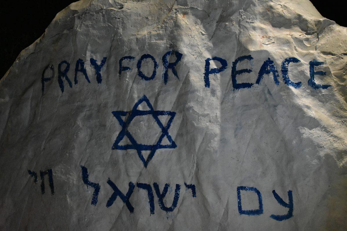 Students paint the Rock in remembrance of the lives lost in the Hamas attack in Israel. Thursday, Oct. 12, 2023.