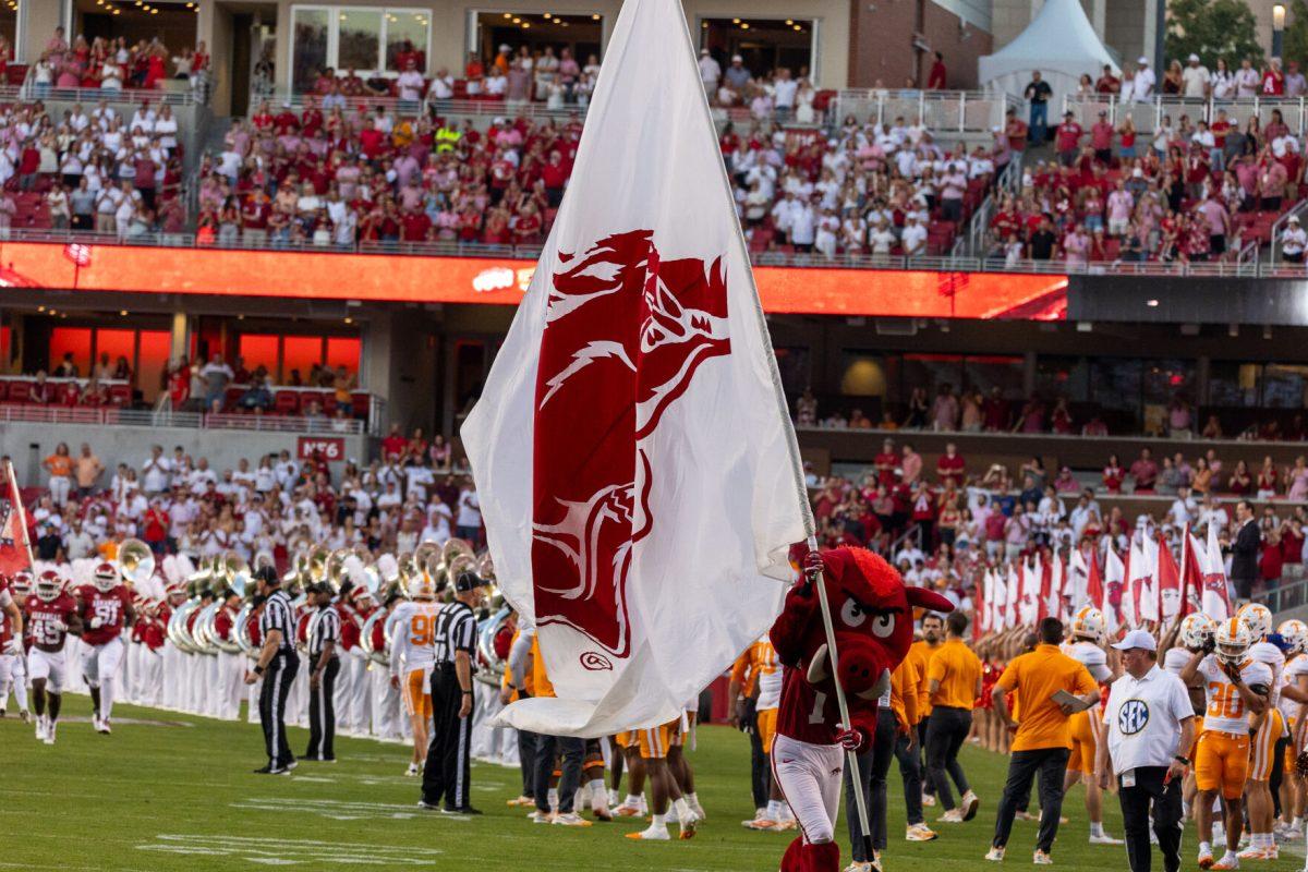 Arkansas runs onto the field before a game against Tennessee at Donald W. Reynolds Razorback Stadium. Saturday, Oct. 5, 2024. 