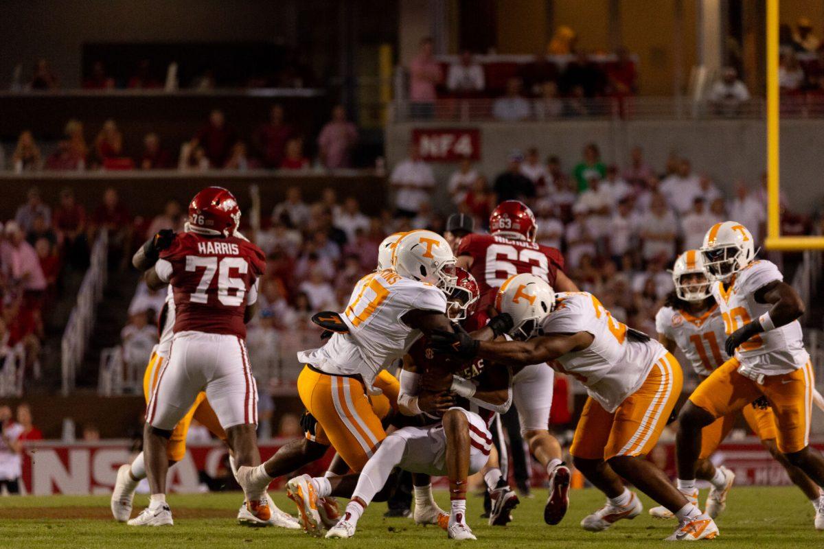 The Tennessee defense swarms the ball during a game against Arkansas at Donald W. Reynolds Razorback Stadium. Saturday, Oct. 5, 2024.