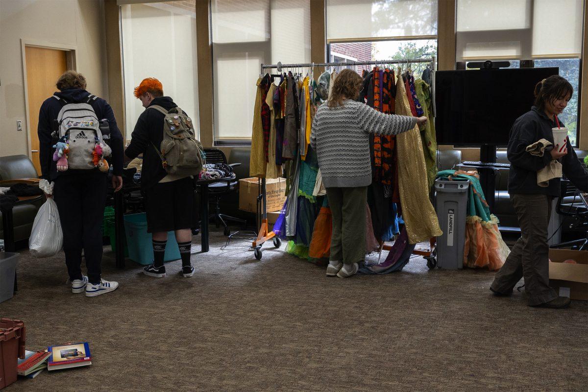 Students shop at the free Halloween pop-up store for costume parts and ideas inside the Mary Greer Room in Hodges Library. Monday, Oct. 28, 2024.