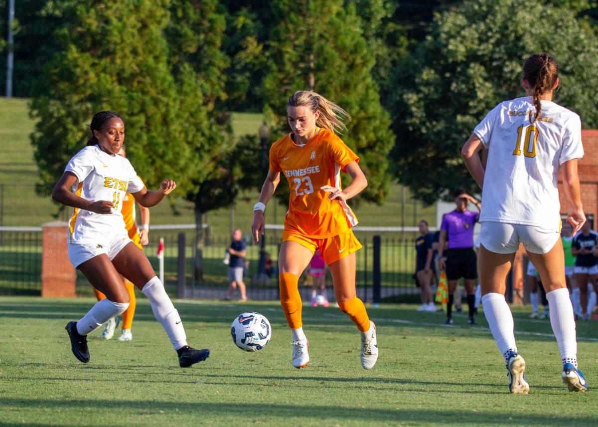Dakota Brown (23) dribbles between defenders during a game against East Tennessee State University at Summers-Taylor Stadium. Friday, Aug. 22, 2024.