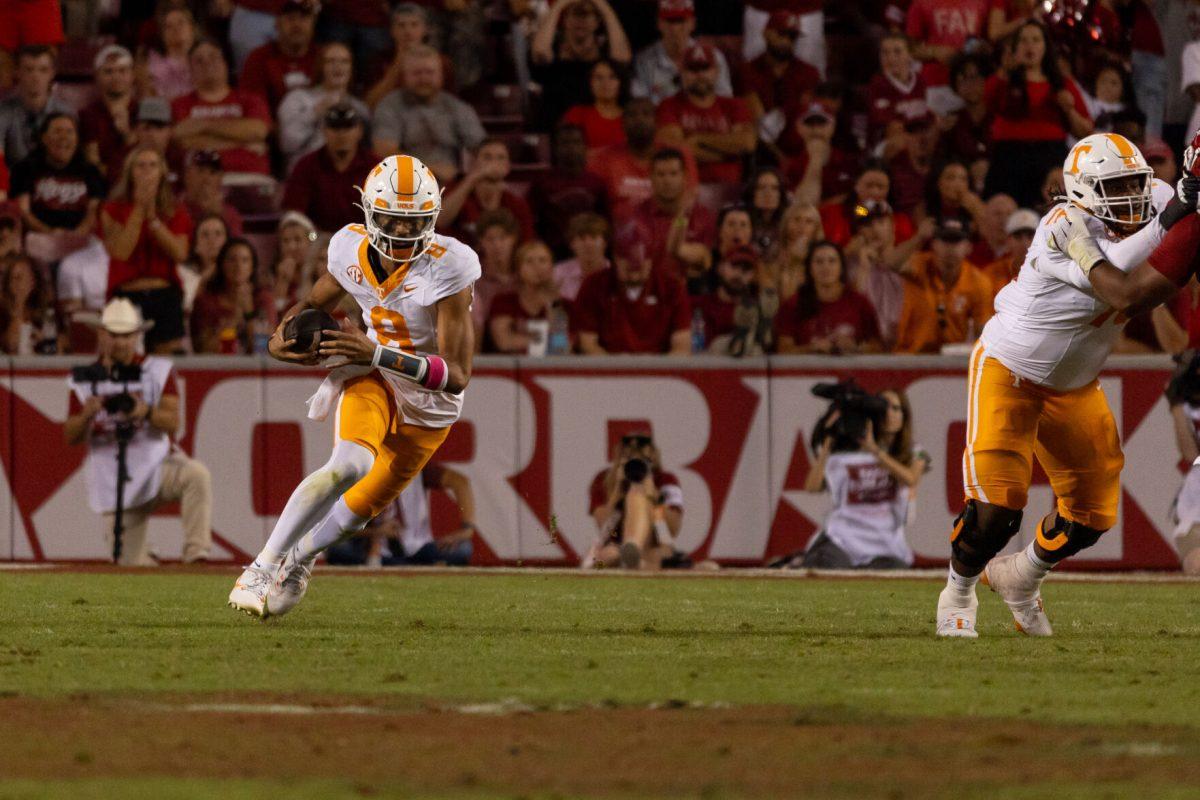 Nico Iamaleava (8) runs the ball during a game against Arkansas at Donald W. Reynolds Razorback Stadium. Saturday, Oct. 5, 2024. 