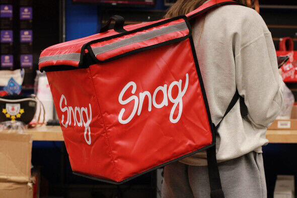 Snag is a new delivery system unique to college campuses. As students walk around, they may see Snag employees wearing backpacks like this to hold the items they are transporting. 