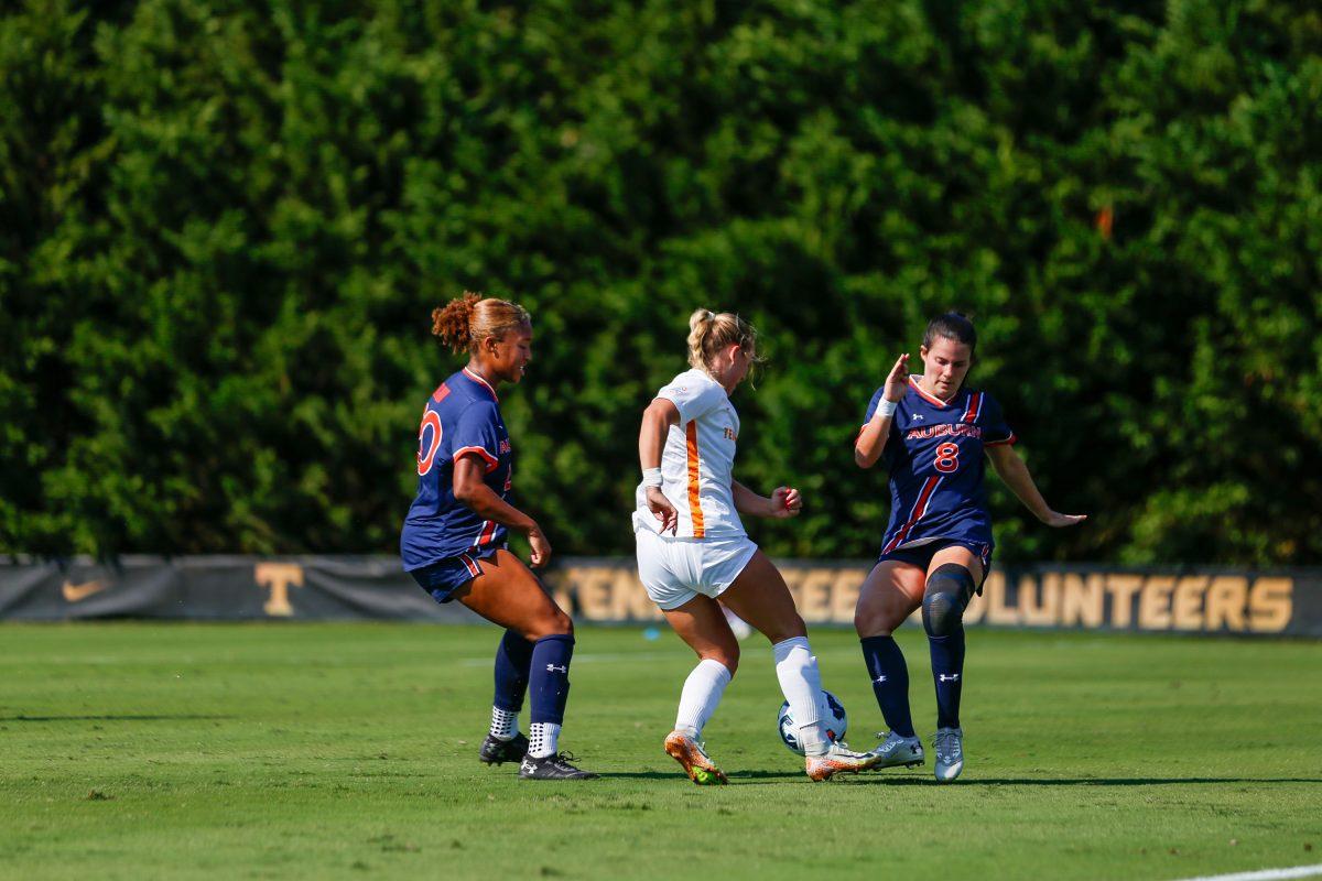 Jenna Stayart (5) dribbles between two Auburn defenders at Regal Soccer Stadium. Sunday, Oct. 13, 2024.