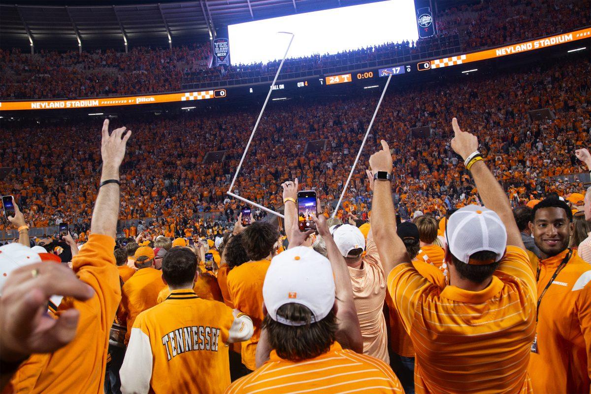 Fans storm the field and tear down the goal posts after the Vols beat Alabama at Neyland Stadium. Saturday, Oct. 19, 2024.