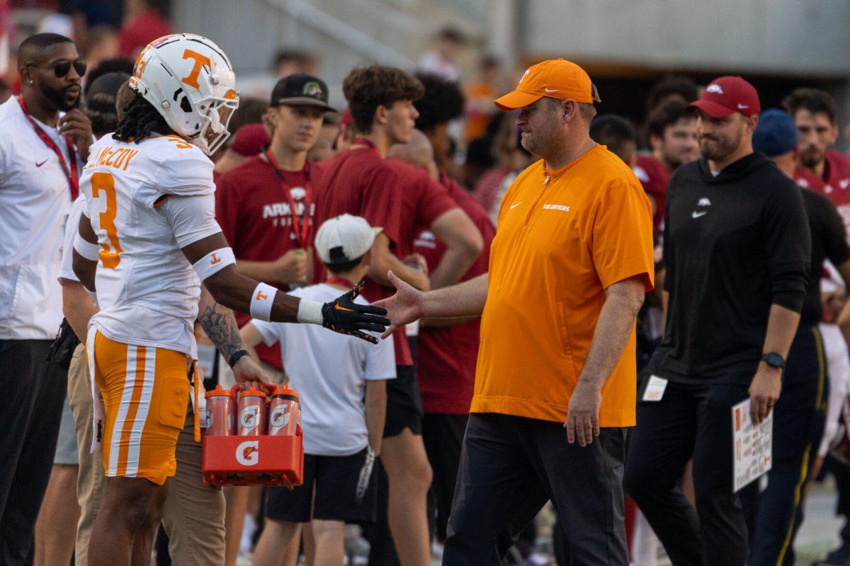 Tennessee head coach Josh Heupel talks with players before a game against Arkansas at Donald W. Reynolds Razorback Stadium. Saturday, Oct. 5, 2024. 