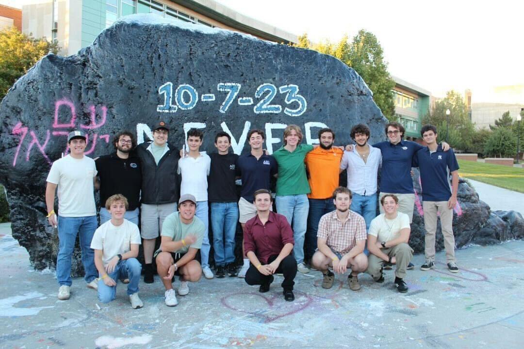 Members of Alpha Epsilon Pi gather for a vigil to honor the lives lost in the attack on Israel. 