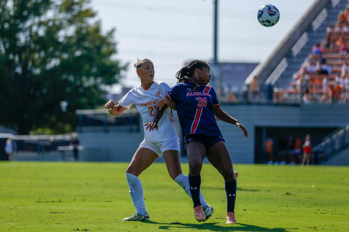 Leah Klurman (21) fights for the ball against an Auburn attacker at Regal Soccer Stadium. Sunday, Oct. 13, 2024.