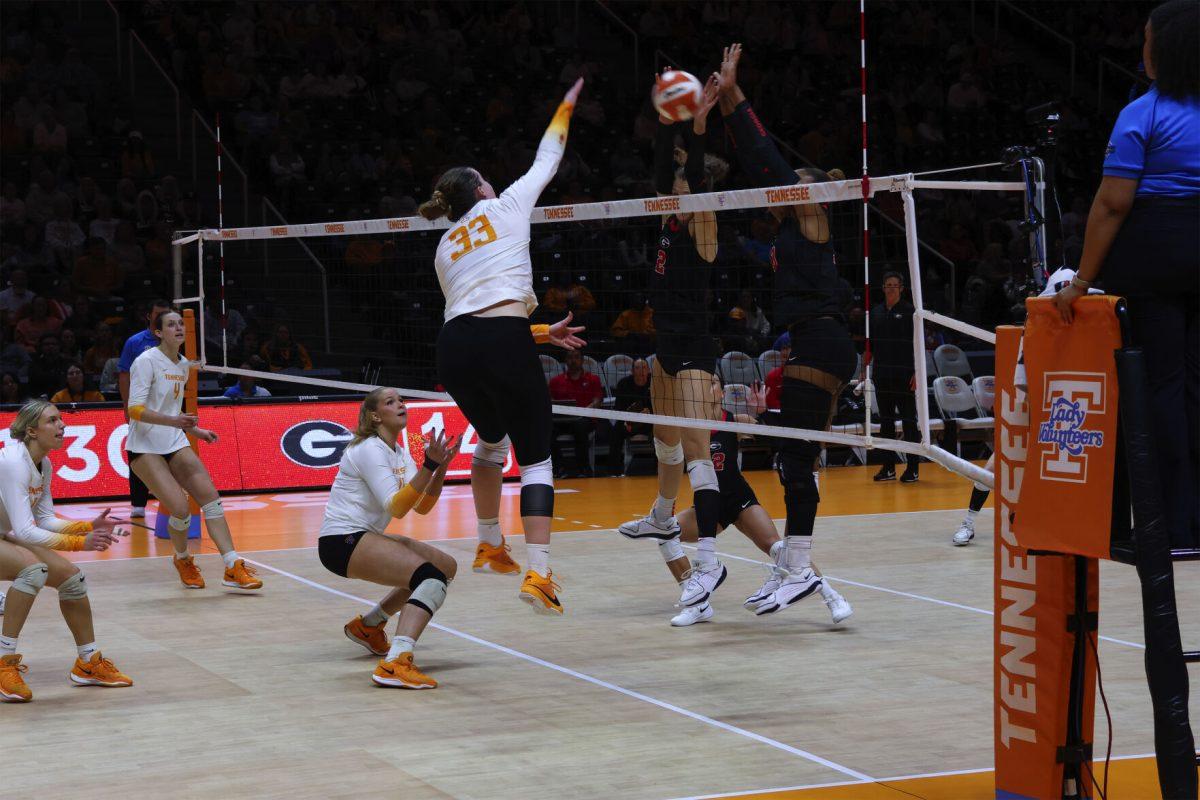 Hayden Kubik (33) attempts to spike the ball against Georgia at Thompson-Boling Arena. Friday, Nov. 15, 2024.