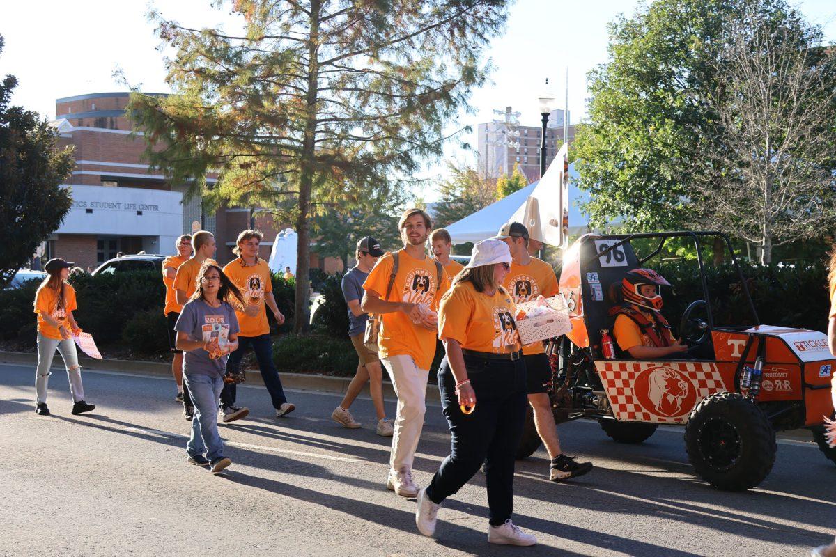 Students from the Tickle College of Engineering pass out goodies during the 2024 Homecoming Parade. Friday, Nov. 8, 2024.
