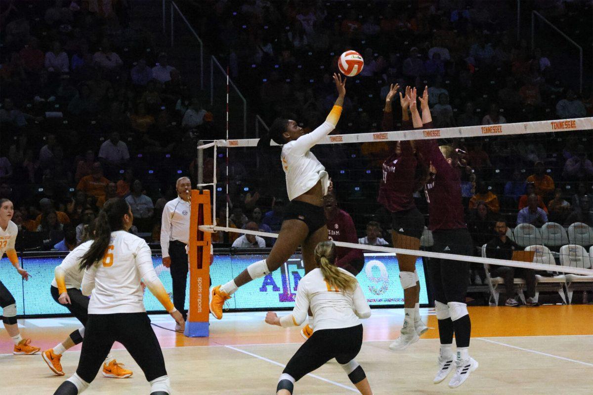 Keondreya Granberry (77) tips the ball over the net against Texas A&amp;M at Thompson-Boling Arena at Food City Center. Sunday, Nov. 10, 2024.