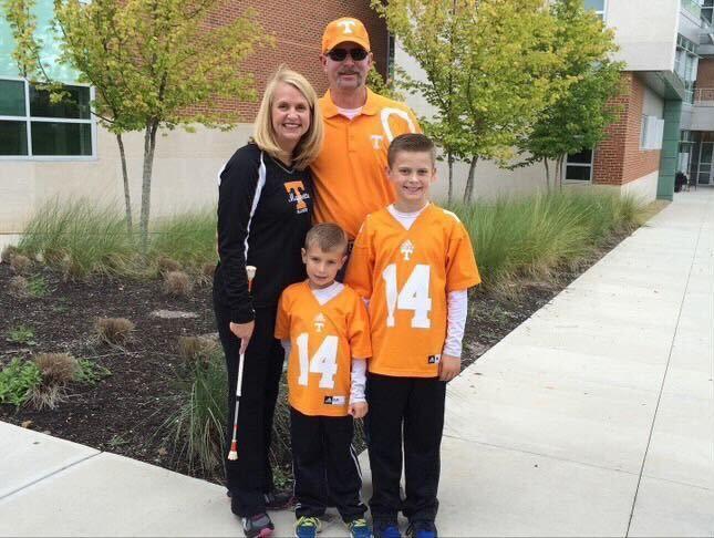 The Johnson family cheers on the Vols in UT colors before a football game in 2014.