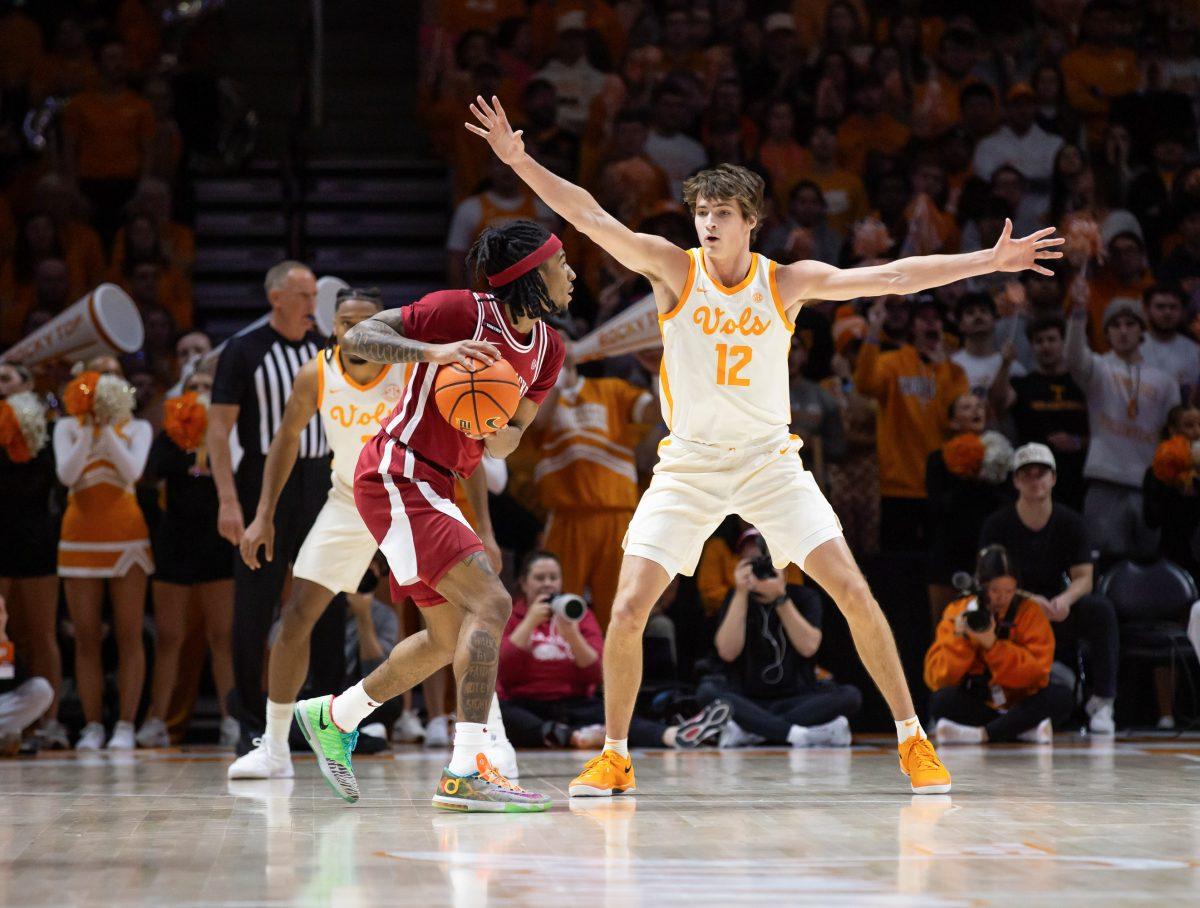 Cade Phillips (12) prepares to block an Arkansas player at Thompson-Boling Arena at Food City Center. Saturday, Jan. 4, 2025.