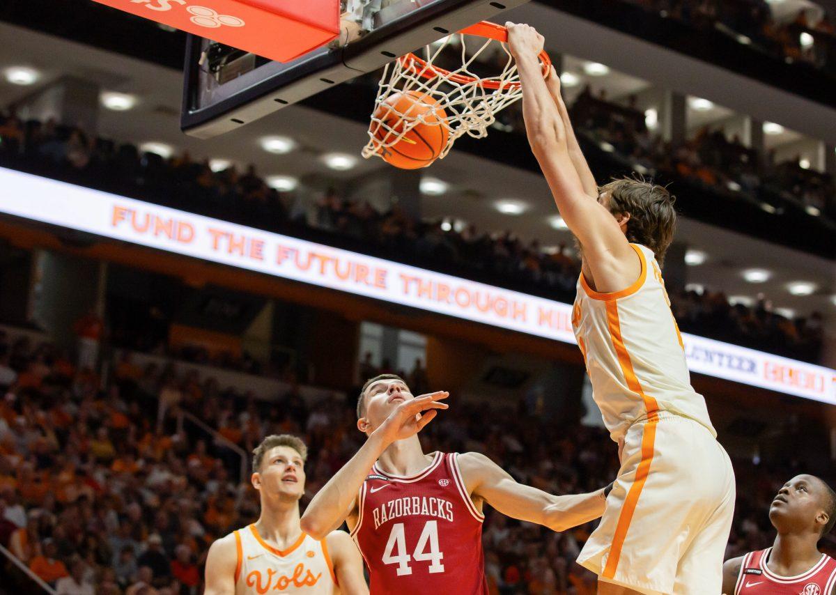 Cade Phillips (12) dunks on Arkansas at Thompson-Boling Arena at Food City Center. Saturday, Jan. 4, 2025.