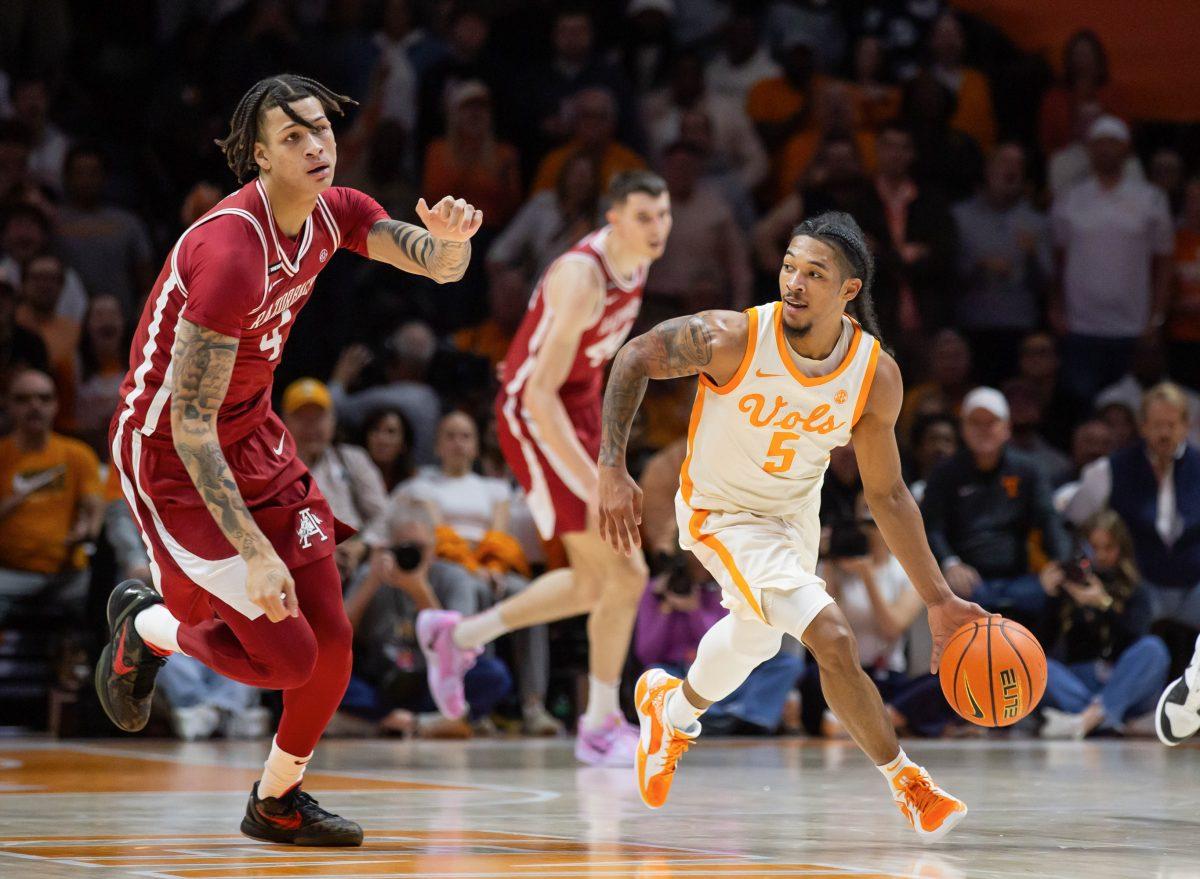 Zakai Zeigler (5) steals the ball from Arkansas at Thompson-Boling Arena at Food City Center. Saturday, Jan. 4, 2025.