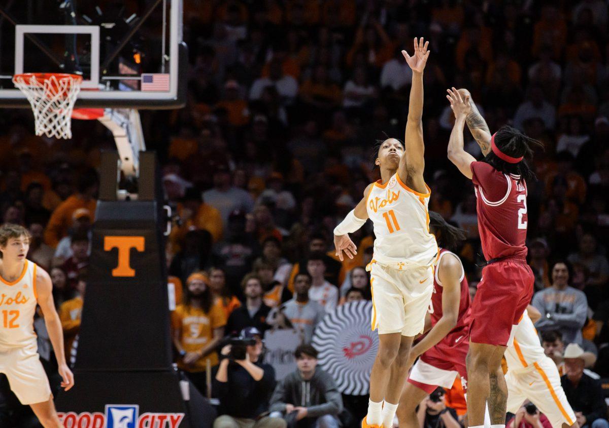 Jordan Gainey (11) blocks an Arkansas player at Thompson-Boling Arena at Food City Center. Saturday, Jan. 4, 2025.