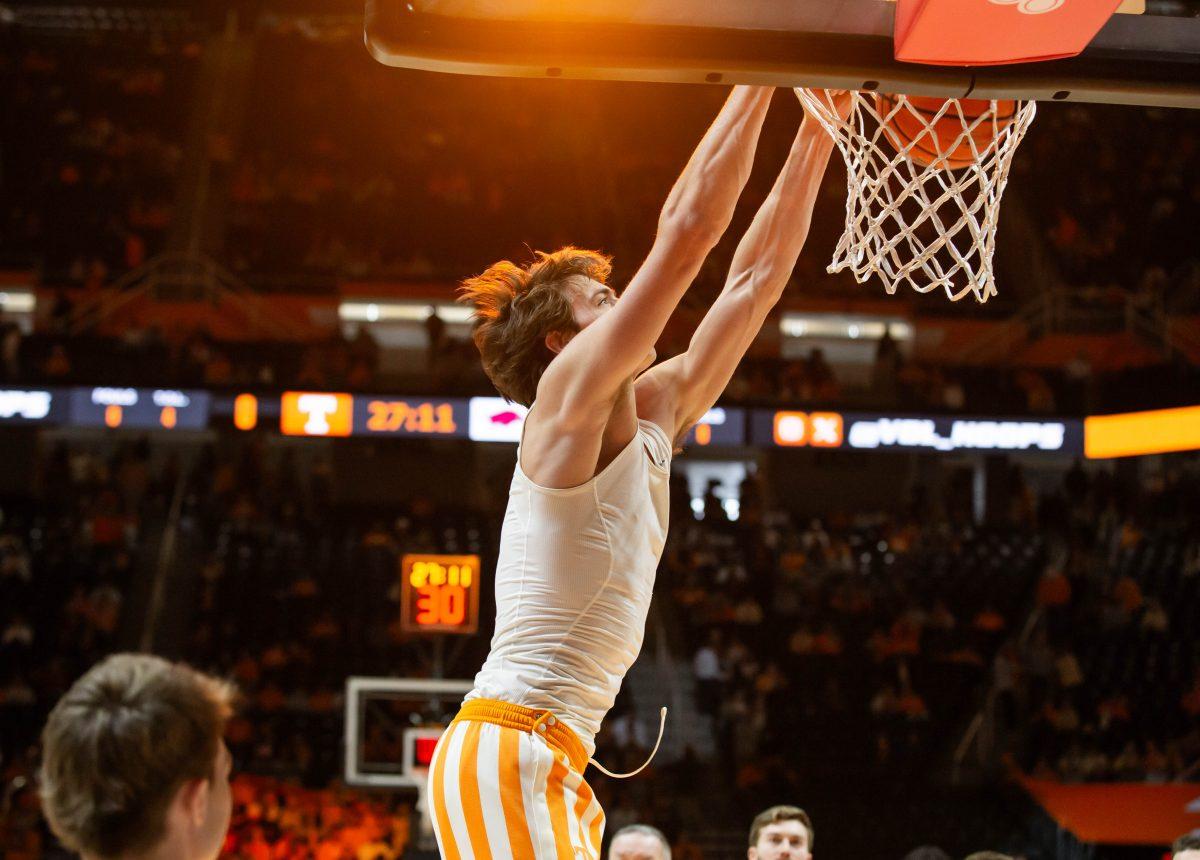 Cade Phillips (12) dunks the ball during warm-ups at the Arkansas game at Thompson-Boling Arena at Food City Center. Saturday, Jan. 4, 2025.
