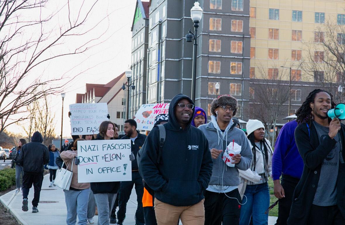 Students participating in the protest against fascism march down Pedestrian Walkway. Monday, Feb. 17, 2025.
