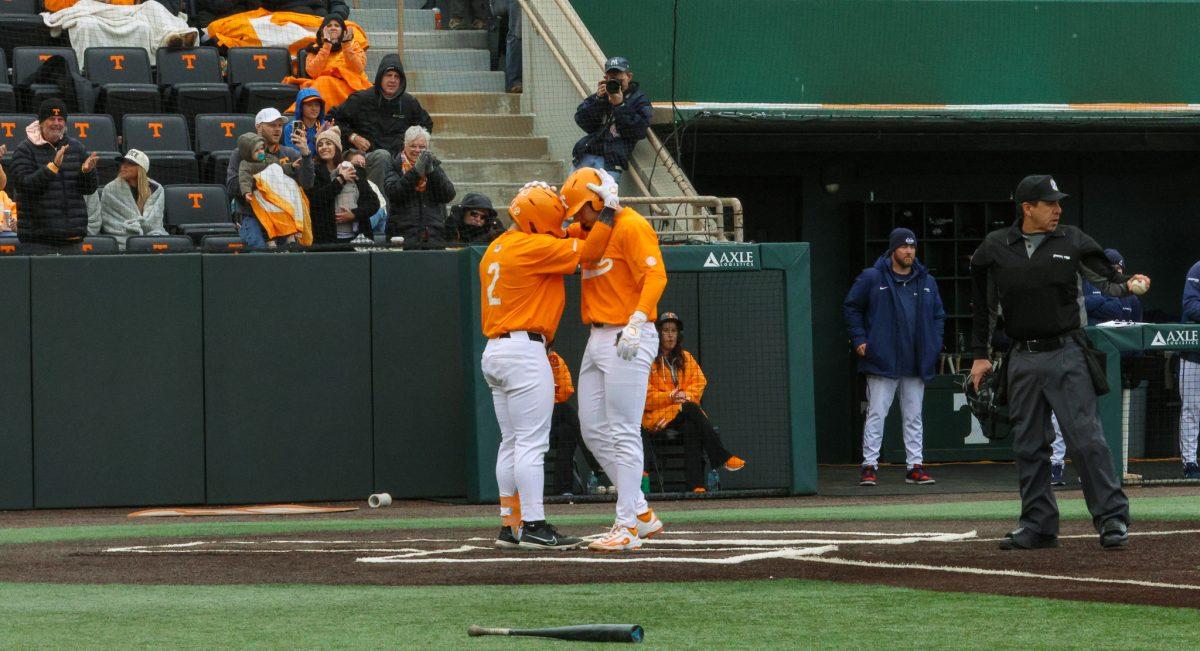Dalton Bargo (16) and Ariel Antigua (2) celebrate after Bargo's home run against Samford at Lindsey Nelson Stadium. Saturday, Feb. 22, 2025.