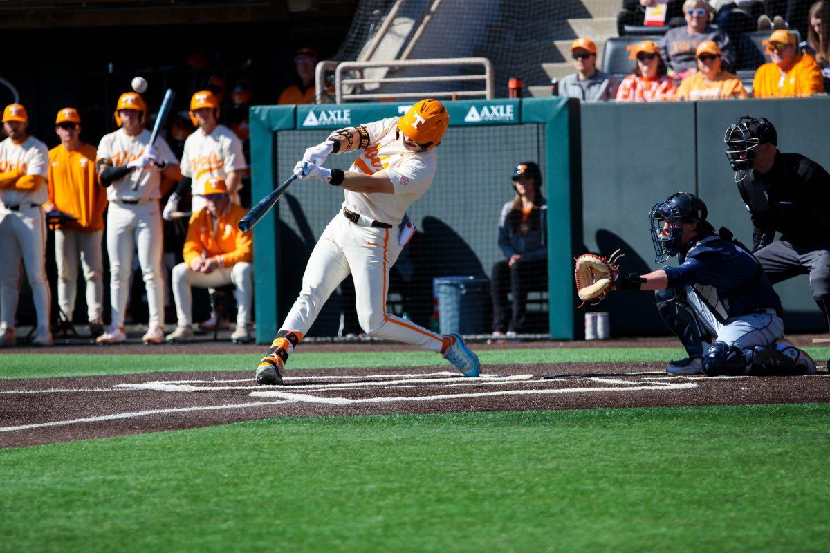 Andrew Fischer (11) swings at pitch in game against Samford at Lindsey Nelson Stadium. Sunday, Feb. 23, 2025.
