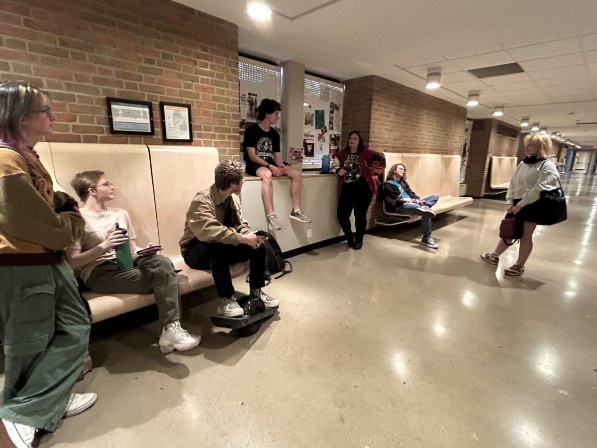 A group of students waited outside HSS 106, where the College Republicans were expected to meet. Thursday, Feb. 6, 2025.