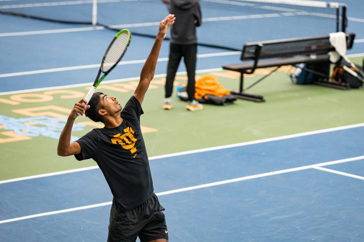 Alan Jesudason serves the ball during a doubles match against Tennessee State at Goodfriend Tennis Center. Saturday, Feb. 14, 2025.