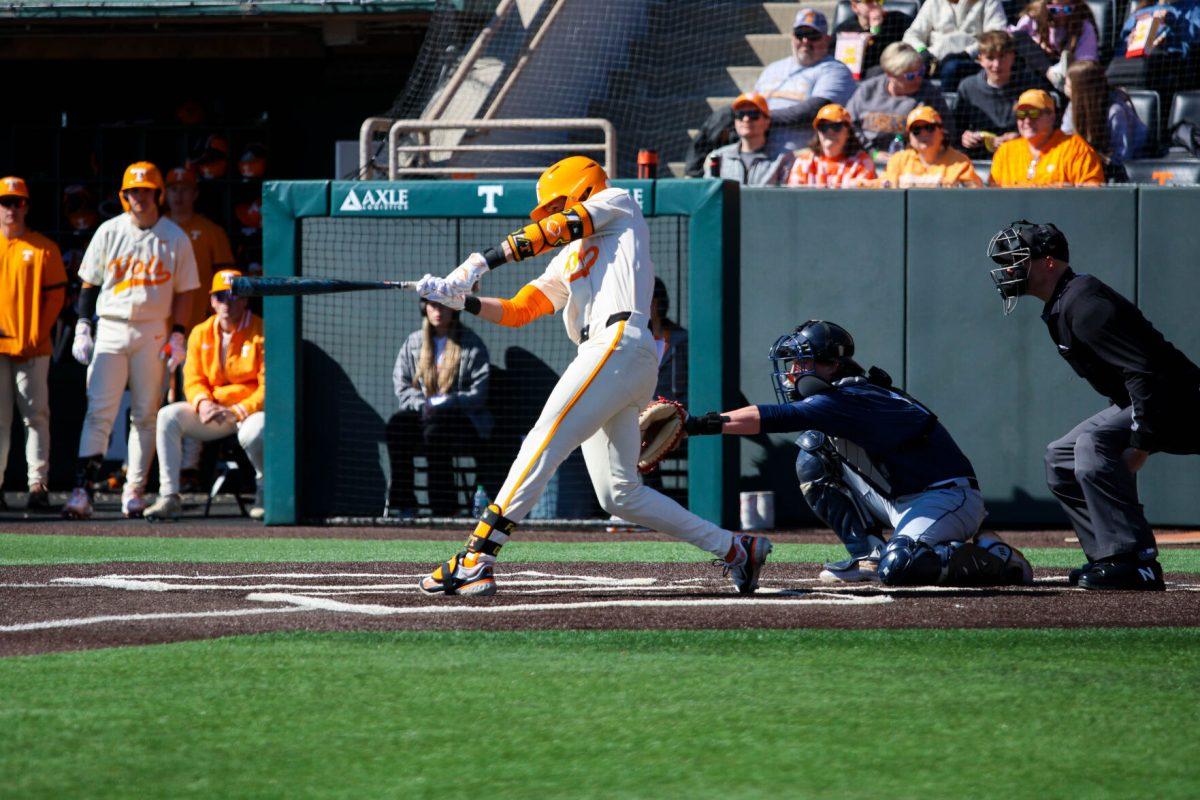 Manny Marin (4) swings at a pitch in game against Samford at Lindsey Nelson Stadium. Sunday, Feb. 23, 2025.