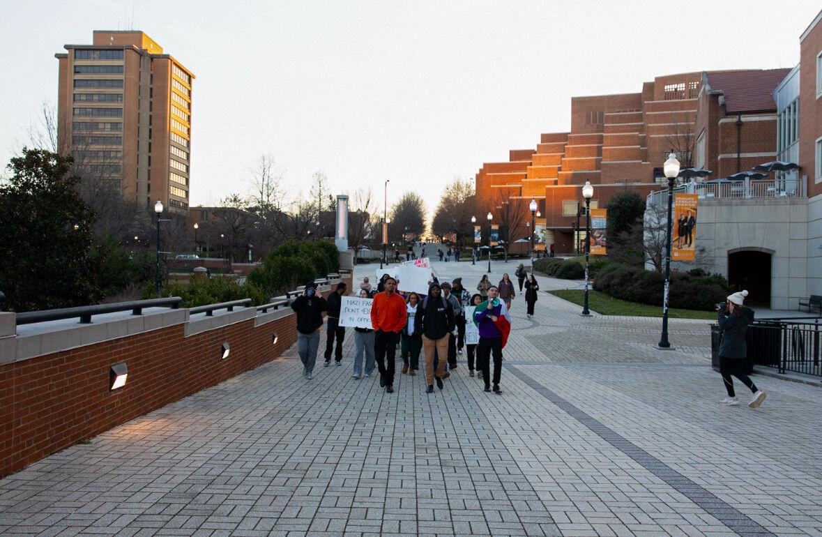 Students participating in the protest against fascism march down Pedestrian Walkway. Monday, Feb. 17, 2025.