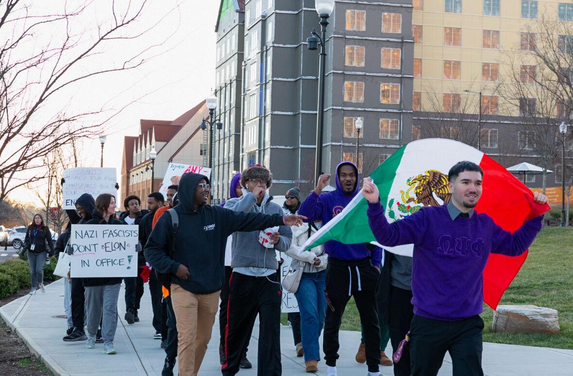 Students participating in the protest against fascism march down Pedestrian Walkway with Eli Aguilar leading. Monday, Feb. 17, 2025.