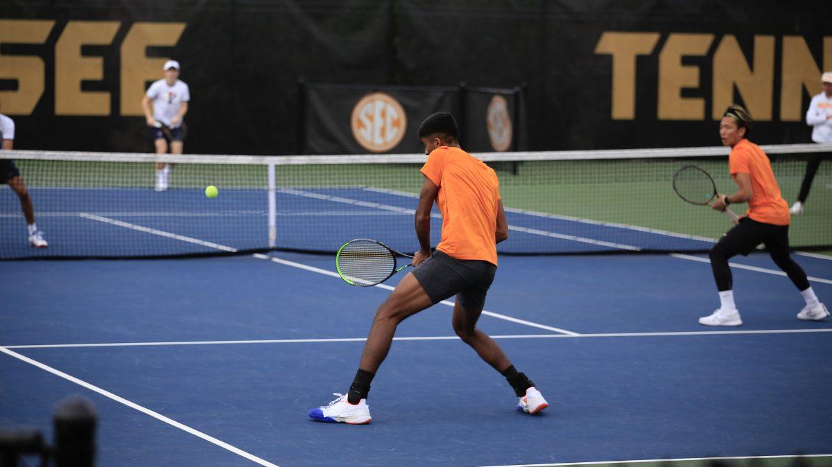 Alan Jesudason backhands the return during the match against Penn at Barksdale Stadium. Saturday, Feb. 8, 2025.