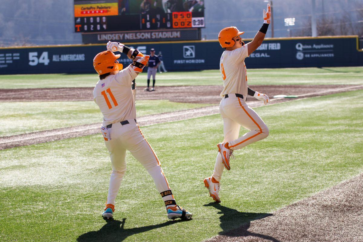 Hunter Ensley (9) and Andrew Fischer (11) celebrate Ensley's homerun against Samford at Lindsey Nelson Stadium. Sunday, Feb. 23, 2025.