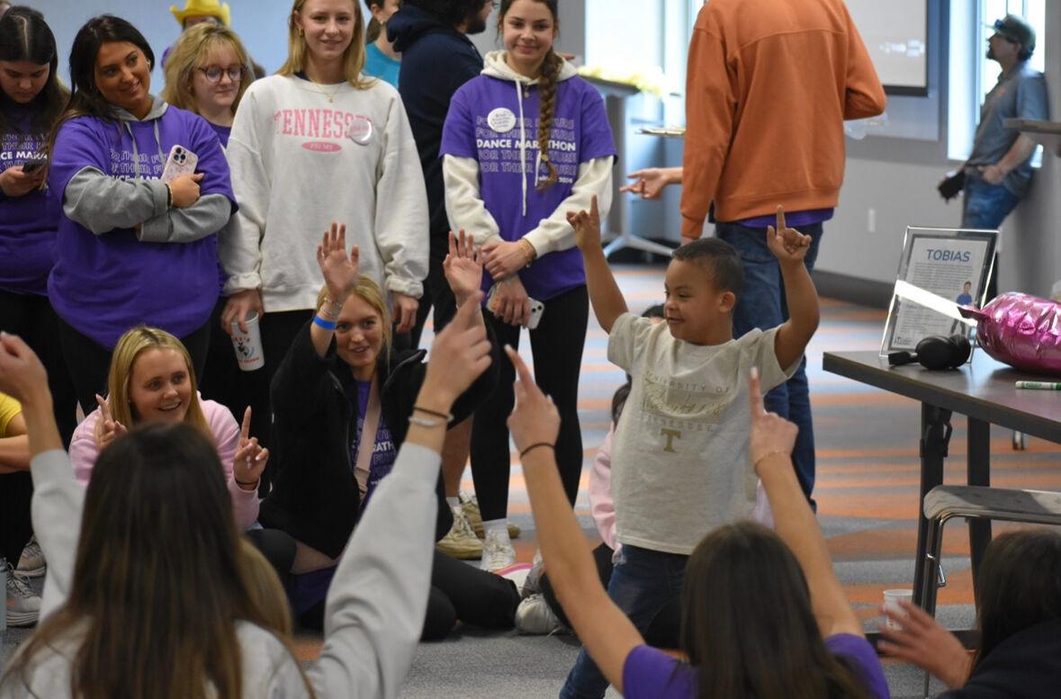 Dance Marathon participants play a game with miracle kids.