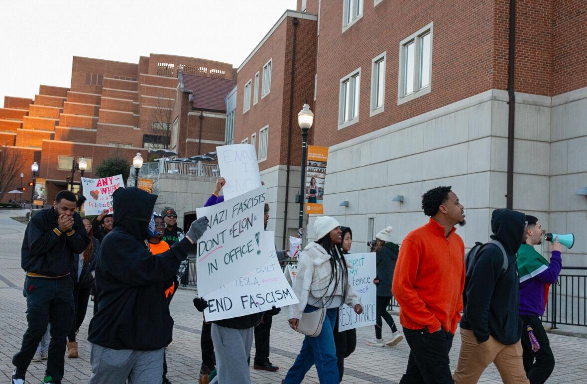 Students participating in the protest against fascism march down Pedestrian Walkway. Monday, Feb. 17, 2025.
