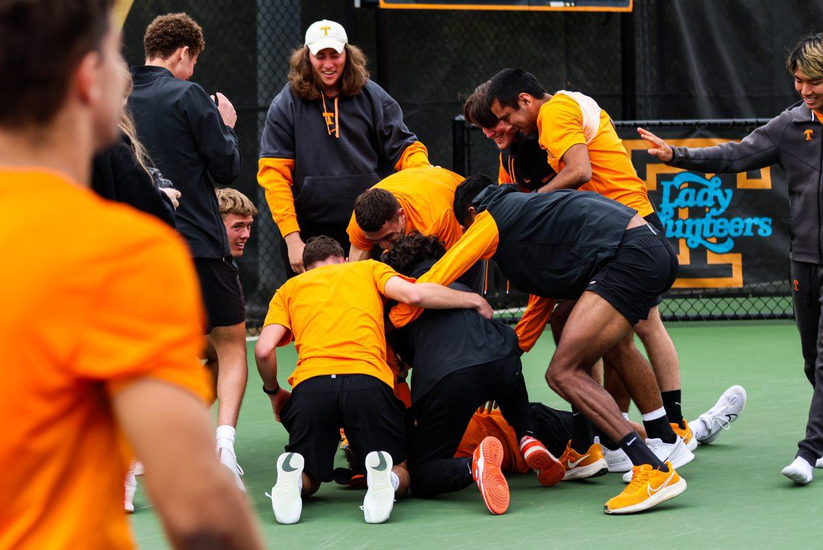 Alejandro Moreno’s teammates dog pile on top of him after he clutches the win for the Vols against Kentucky at Barksdale Stadium. Sunday, Mar. 9, 2025.