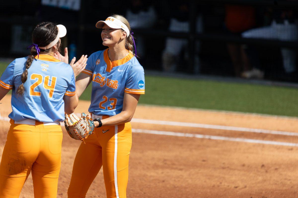 Karlyn Pickens (23) and McKenna Gibson (24) celebrate a strikeout against Virginia in the Knoxville Regional at Sherri Parker Lee Stadium. Sunday, May 19, 2024. 