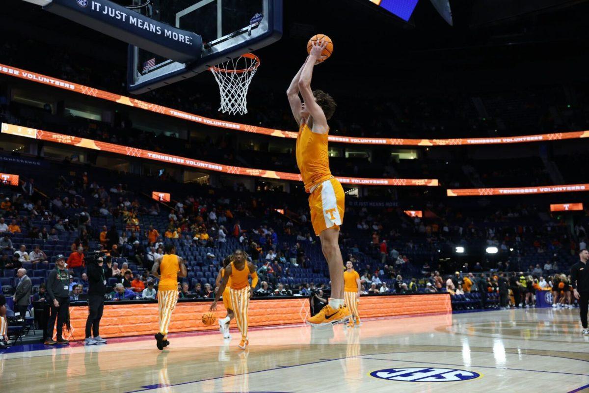 Cade Phillips (12) attempts a dunk during warmups before SEC Tournament semifinal game against Auburn. Saturday, March 15, 2025. 