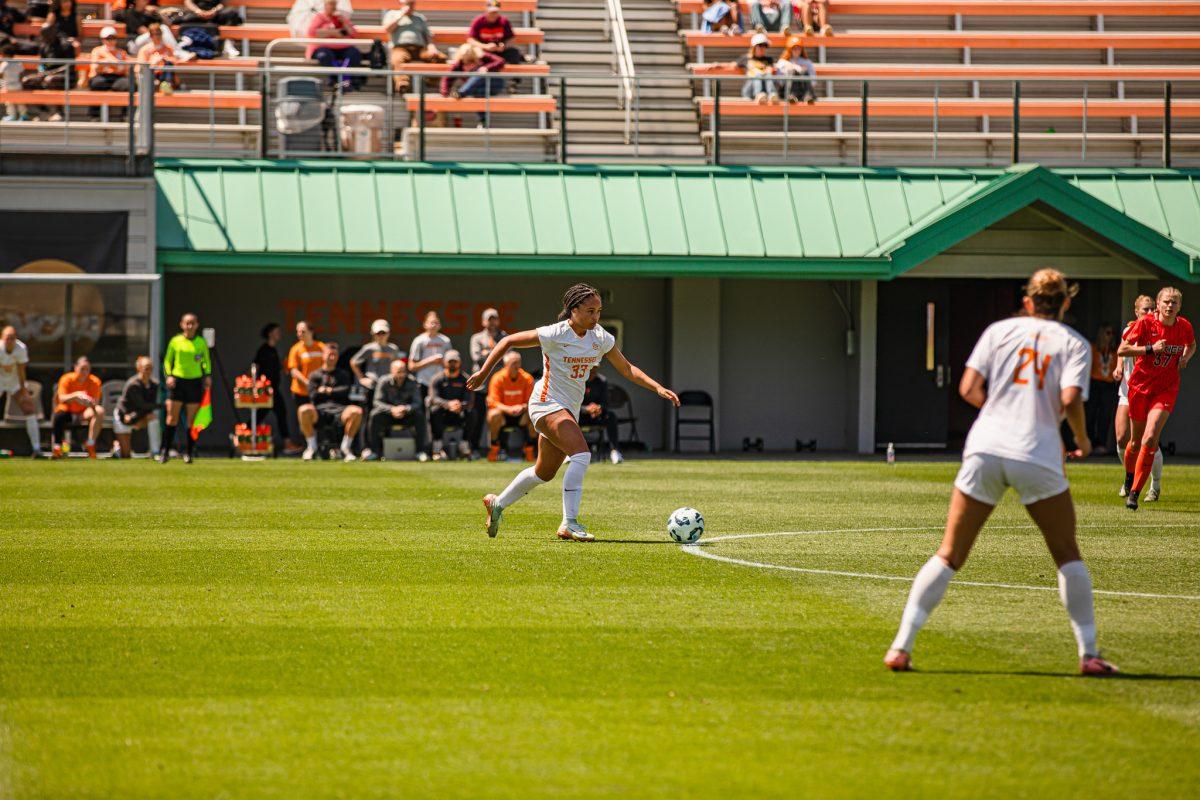 Nyla Blue (33) dribbles the ball up the field during a spring matchup against Virginia Tech at Regal Stadium. Sunday, April 13, 2025.