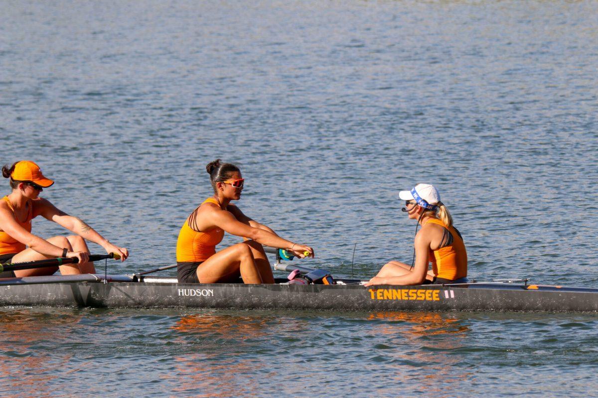 From left to right: Jamie Harris, Channing Taner and coxswain Taryn Graves seen following their first place finish during Rocky Top Invite at Melton Hill Lake. Friday, April 4, 2025. 
