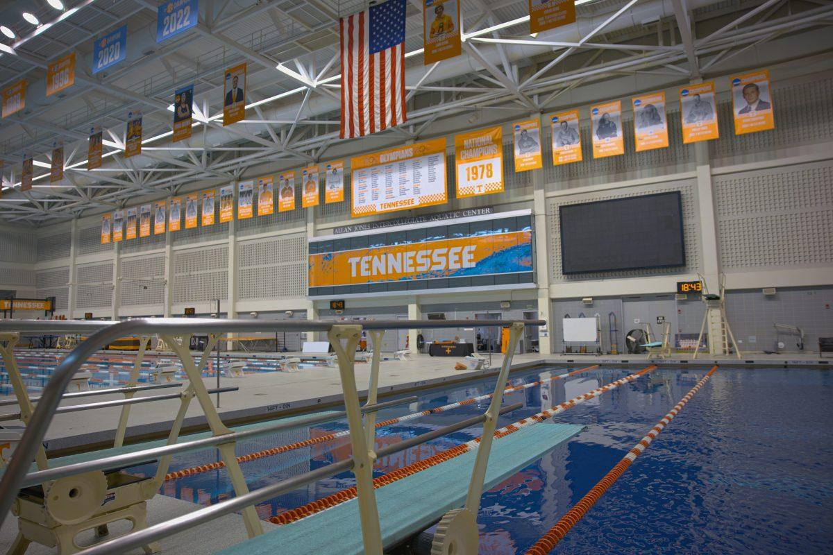 NCAA Championship banners hang beyond a diving board at the Allen Jones Aquatic Center. Tuesday, April 22, 2025.