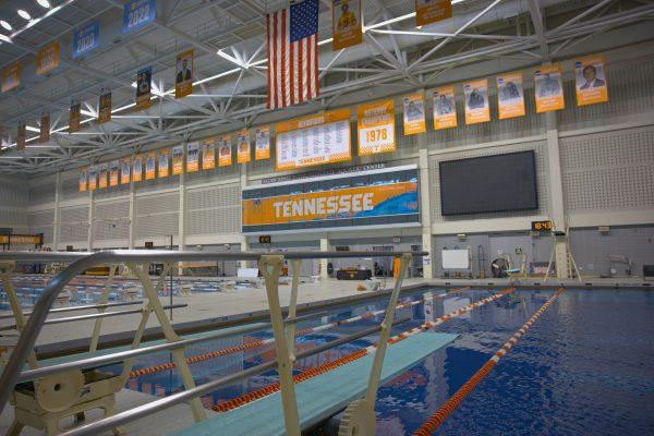NCAA Championship banners hang beyond a diving board at the Allen Jones Aquatic Center. Tuesday, April 22, 2025.