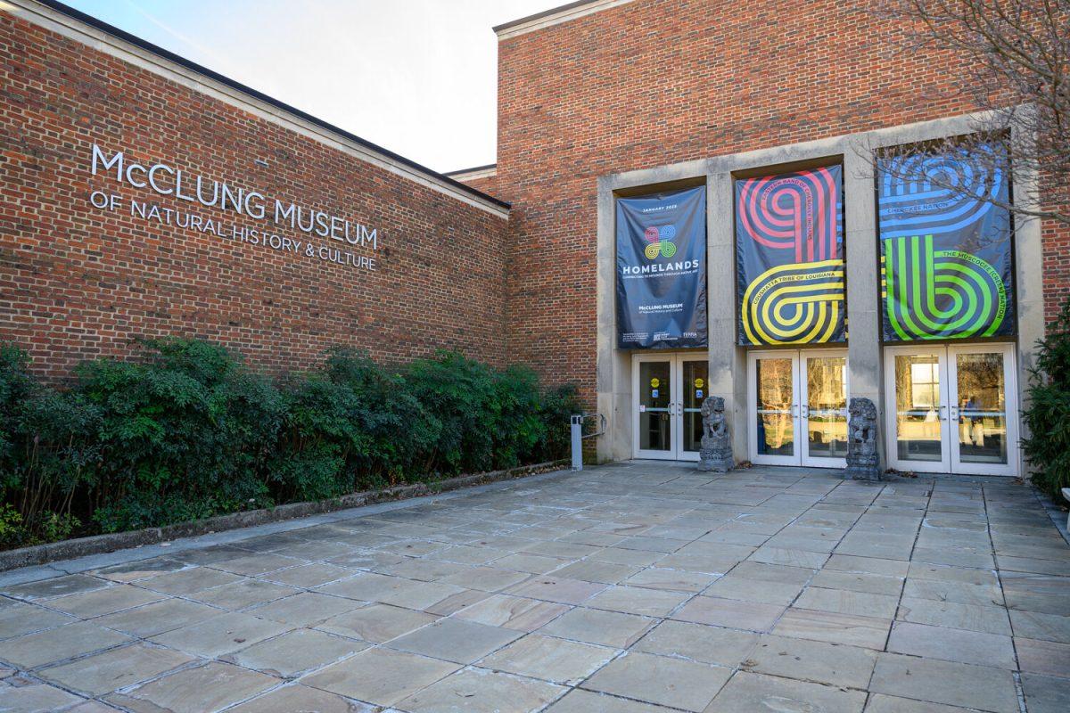 The front entrance of the McClung Museum of Natural History and Culture, located at the edge of Circle Park. There are banners hanging across the entrance highlighting the Homelands exhibit.