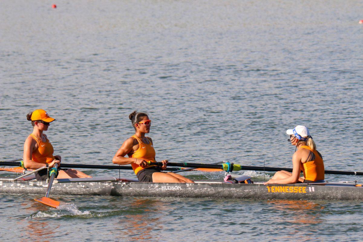 From left to right: Jamie Harris, Channing Taner and coxswain Taryn Graves seen following their first place finish during Rocky Top Invite at Melton Hill Lake. Friday, April 4, 2025. 