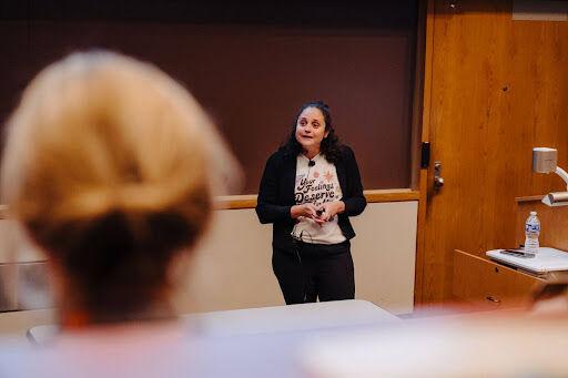 University of Tennessee System Chief Wellness Officer Jessica Gold speaking at an event for Women's History Month. 