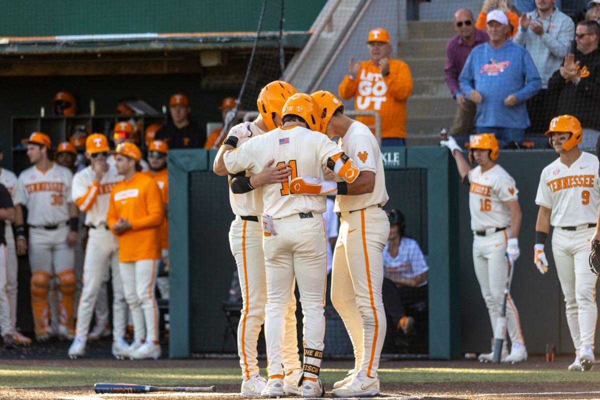 Three players of the Vols Baseball Team celebrate after scoring against Bellarmine Lindsey Nelson Stadium. Tuesday, April 15, 2025.