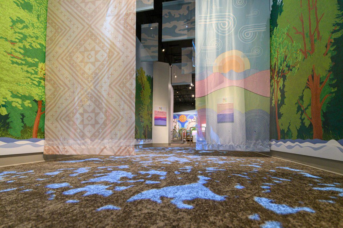 The entrance to the Homelands exhibit. It creates an immersive experience by taking you through a forest and into a mountain valley. 