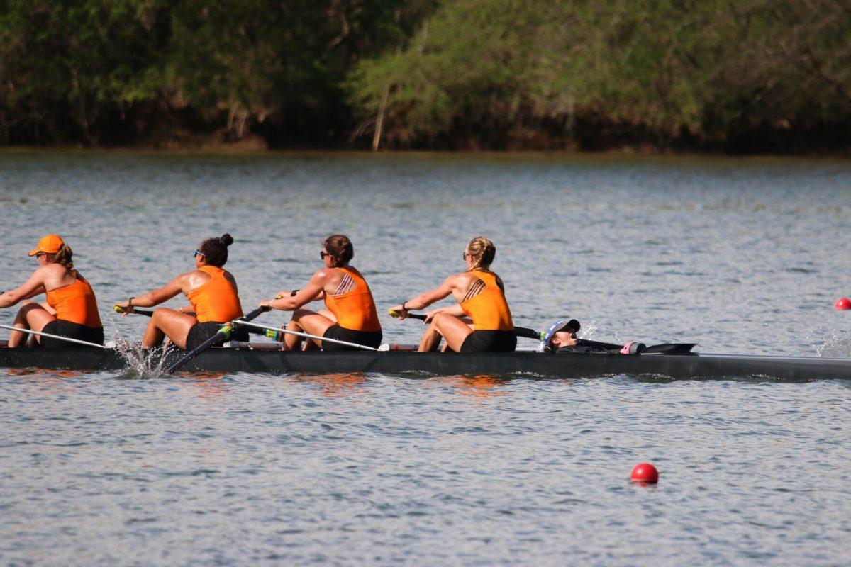 Coxwain Laila Irigoyen seen coaching her boat through the last 500 meters of their race during Rocky Top Invite at Melton Hill Lake. Friday, April 4, 2025.